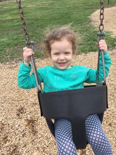 While Aster loved the pizza cookie, she liked the swing even more!