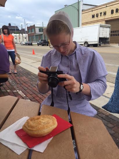 Rosanna photographs her Australian meat pie at the Second Street Market in Dayton...she examined the meaty filling and declared the cuts of beef to be "very high quality"
