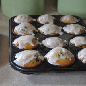 Buttermilk Frosted Blueberry Muffins in a tray