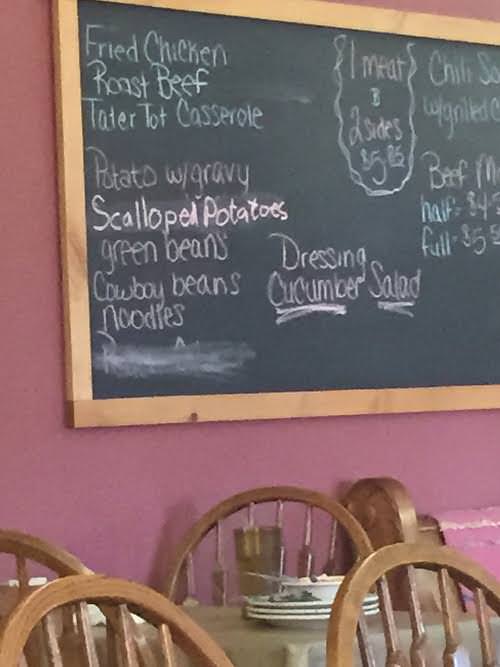 A chalkboard lists the specials