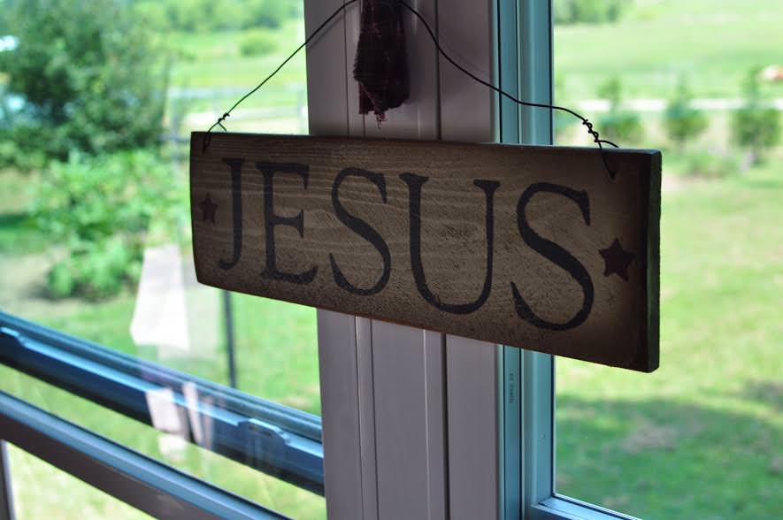 This simple sign in Gloria's kitchen connects her to her faith and Bible studes